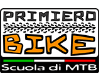 Logo della scuola di mountain bike Primiero Bike, con bandiera italiana.